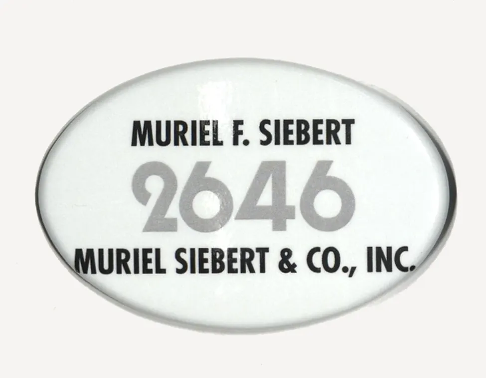 Muriel F. Siebert’s NYSE trading badge with number 2646 and firm name, Muriel Siebert & Co., Inc.