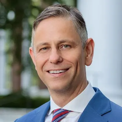 Man smiling in blue suit