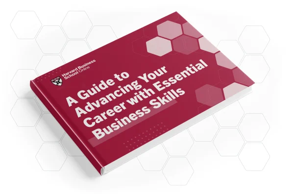 Red Harvard Business School Online book titled ‘A Guide to Advancing Your Career with Essential Business Skills’ with hexagon pattern background.