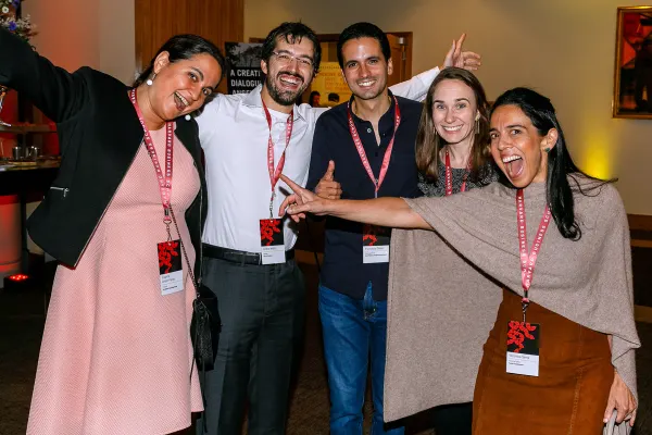 Alumni club members give the thumbs up to a club event.
