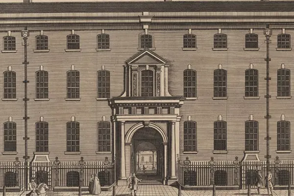 Engraving of a grand 18th-century building with tall windows and an arched entrance, showing people walking and riding horses along the street