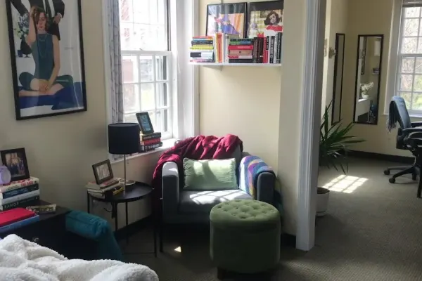 dorm room with a chair and work area