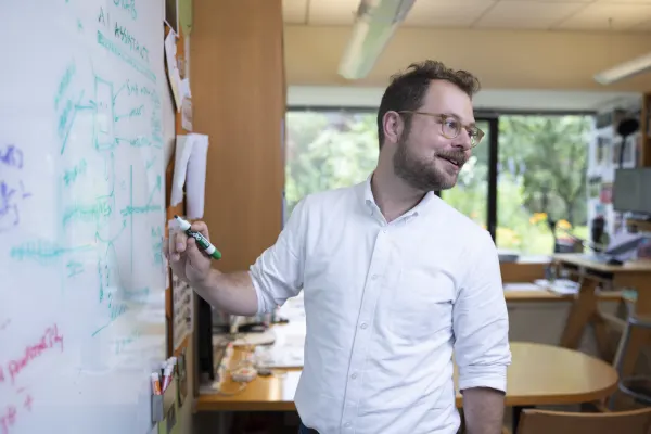 Assoc. Prof. Rembrand Koning at a whiteboard