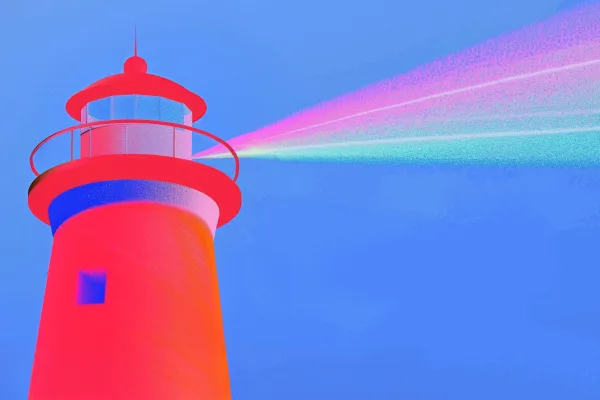 A red lighthouse projecting a colorful beam of light.