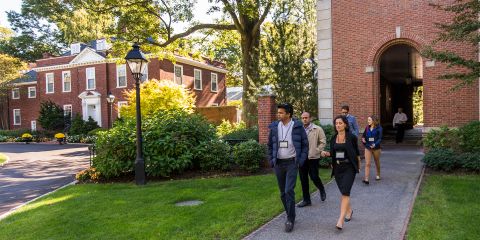 executives walking by the dean's house on the hbs campus