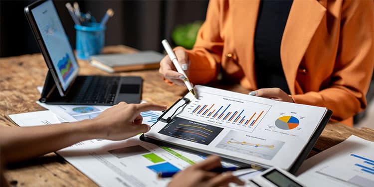 Two marketing professionals reviewing performance data.