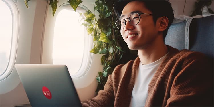 Traveling man on a plane online learning while ivy grows on the walls
