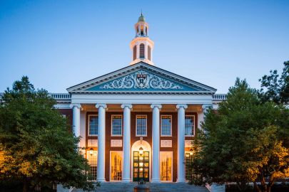 Baker Library-Bloomberg Center pillared entrance on the campus of Harvard Business School at dusk