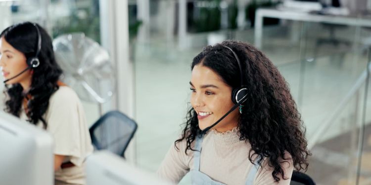 Customer service representative on a phone call with a headset on.