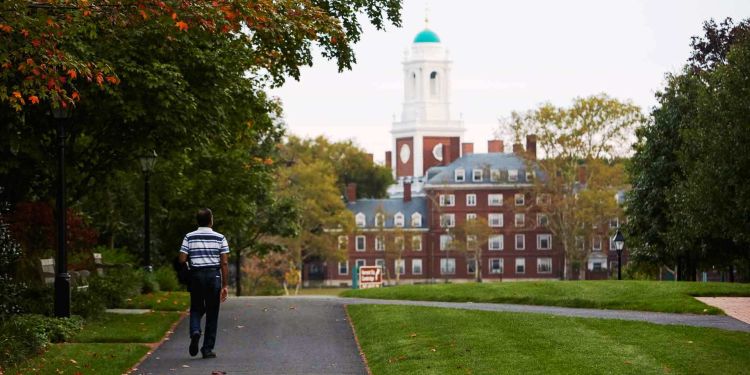 executive walking on the HBS campus