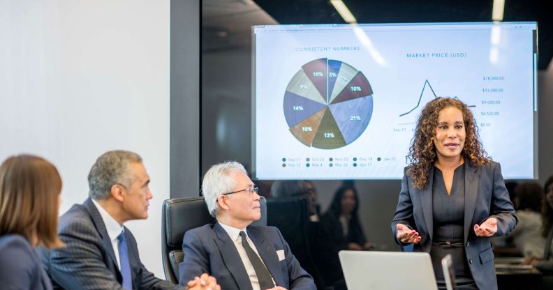 Female executive presents data to the group