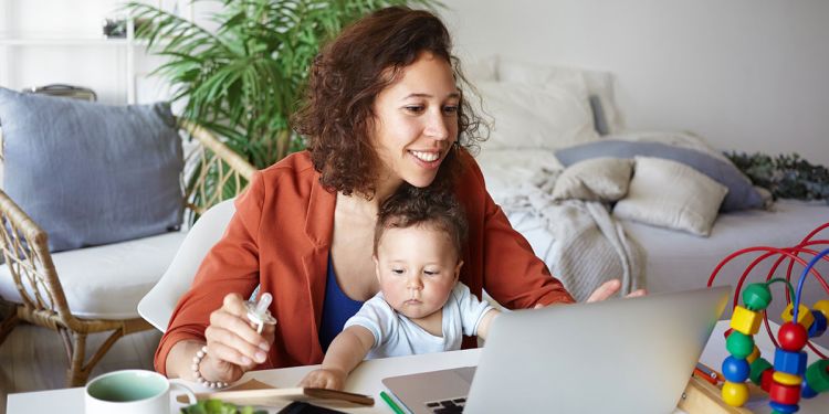mother working from home with toddler