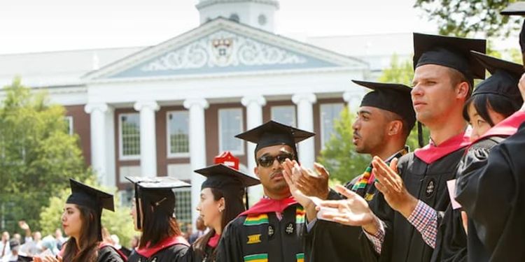 HBS Graduates in front of Baker Library