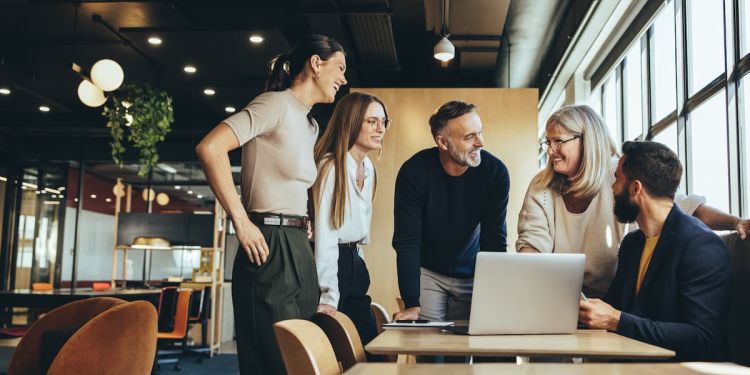 A group of individuals at a business having an engaging discussion.