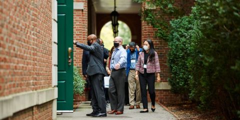 executives walking by the dean's house on the hbs campus