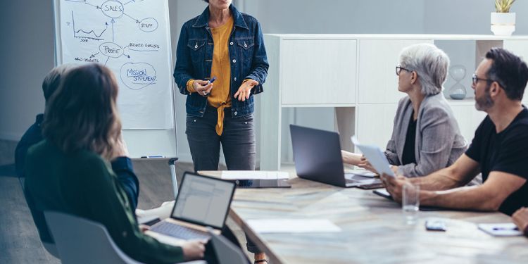 Female manager leading business team meeting