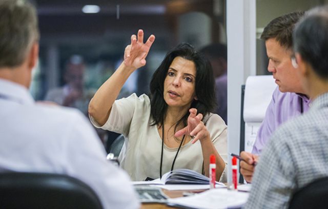 Business professionals having a discussion in the board room