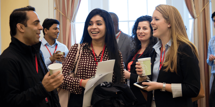 group of students chatting at a networking event