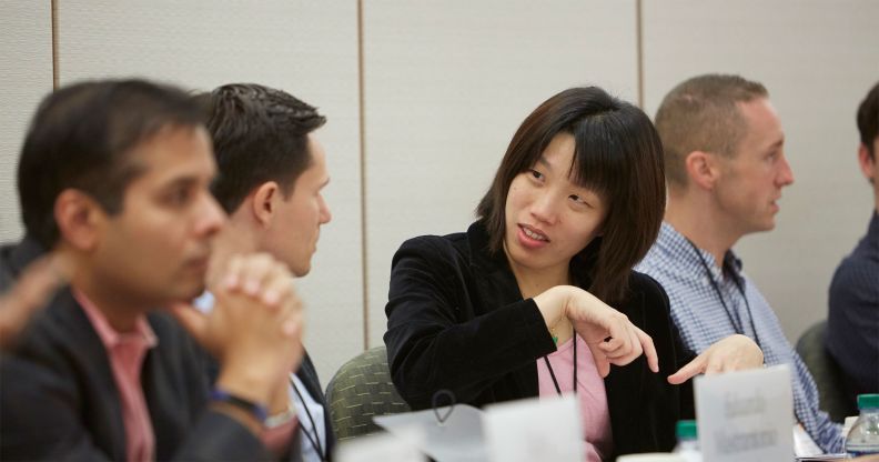 close up of male and female Harvard executive educatiom participants in the classroom
