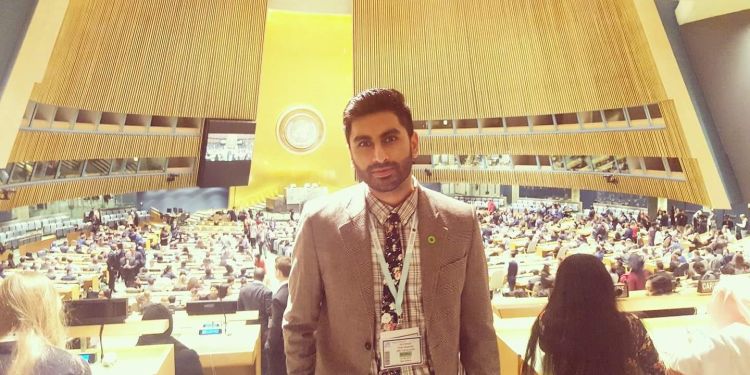 Shahrukh Nasim standing in the US Dept. of Energy