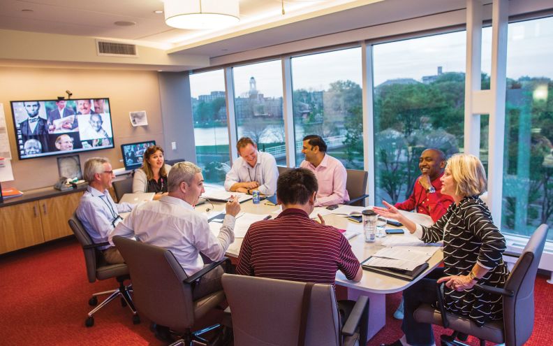 diverse group of Harvard executive education participants in living group discussion