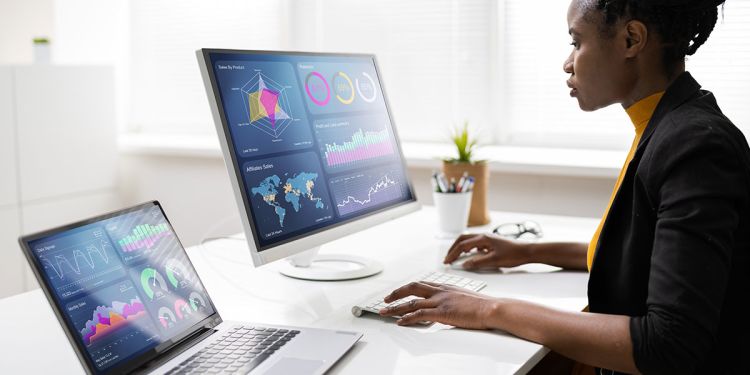 Business professional analyzing data as part of the data life cycle