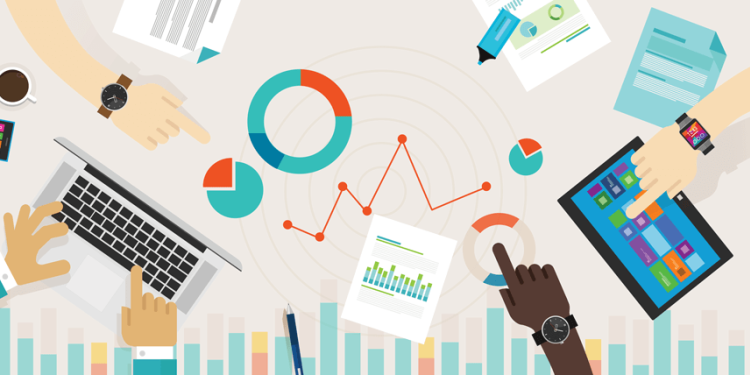 overhead view of hands pointing at charts and graphs