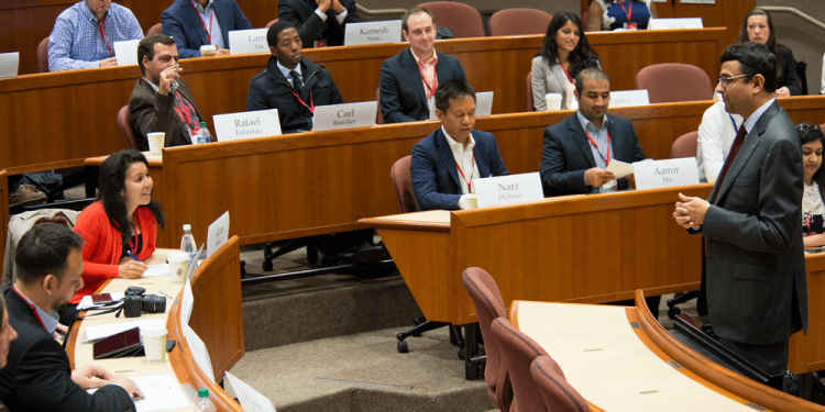 faculty and student engaged in a classroom case discussion