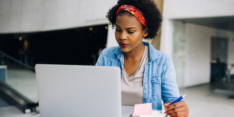 Female College Student Studying with Laptop