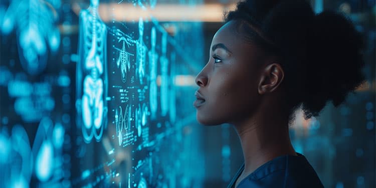 Health care professional reviewing AI medical scans on a screen