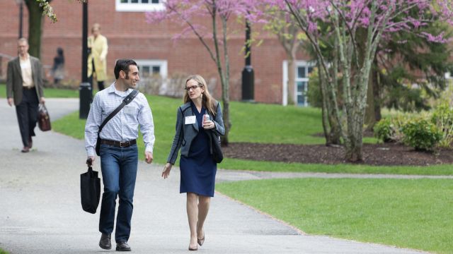 Man and women walking through campus
