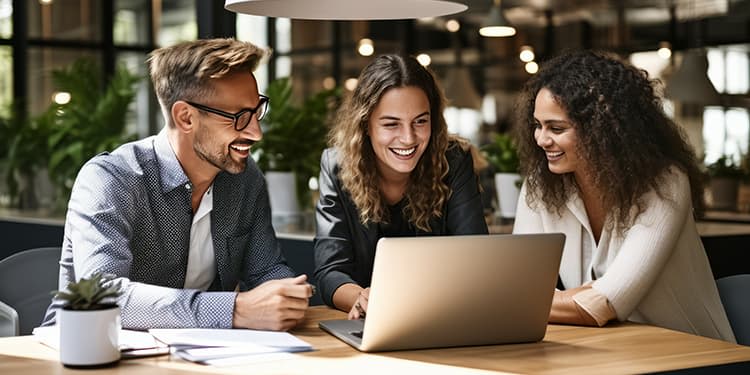 Three employees taking an online training and development course.