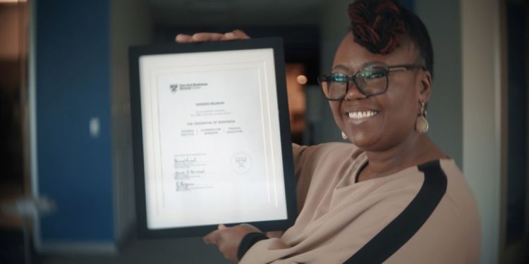 HBS Online Past Participant Sheneka Balogun holding her certificate