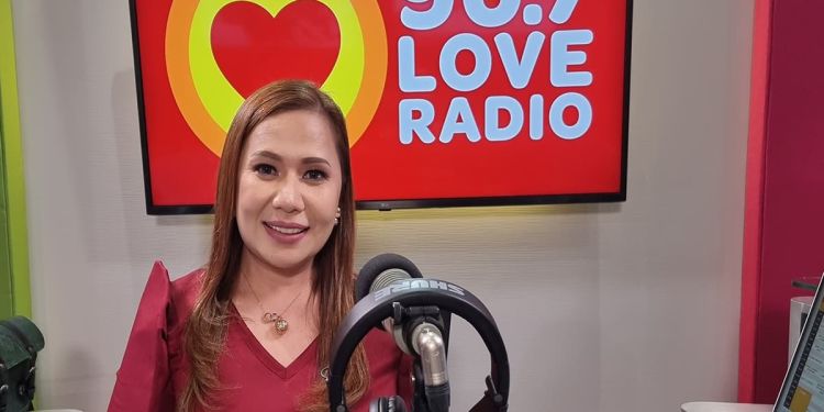 Nicole Hyala behind the microphone at Love Radio Manila